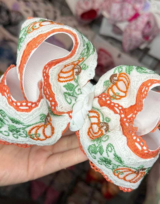 Pumpkin with green lace bows
