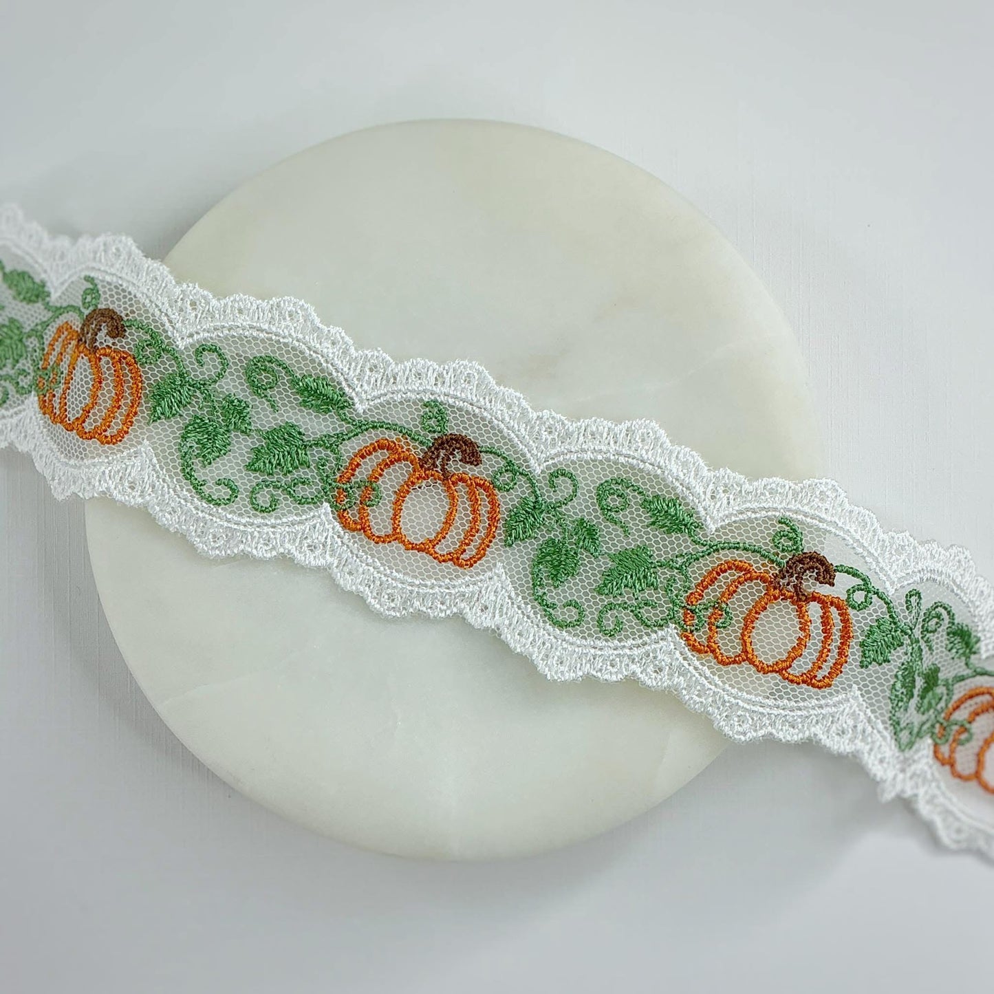 Pumpkin with green lace bows